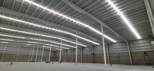 Completed industrial building with rigid frame and lighting